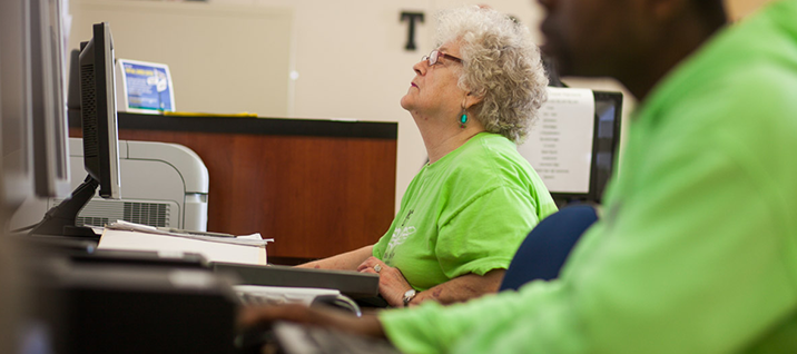 Senior female student looking at courses online