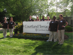 Photo of students in front of sign