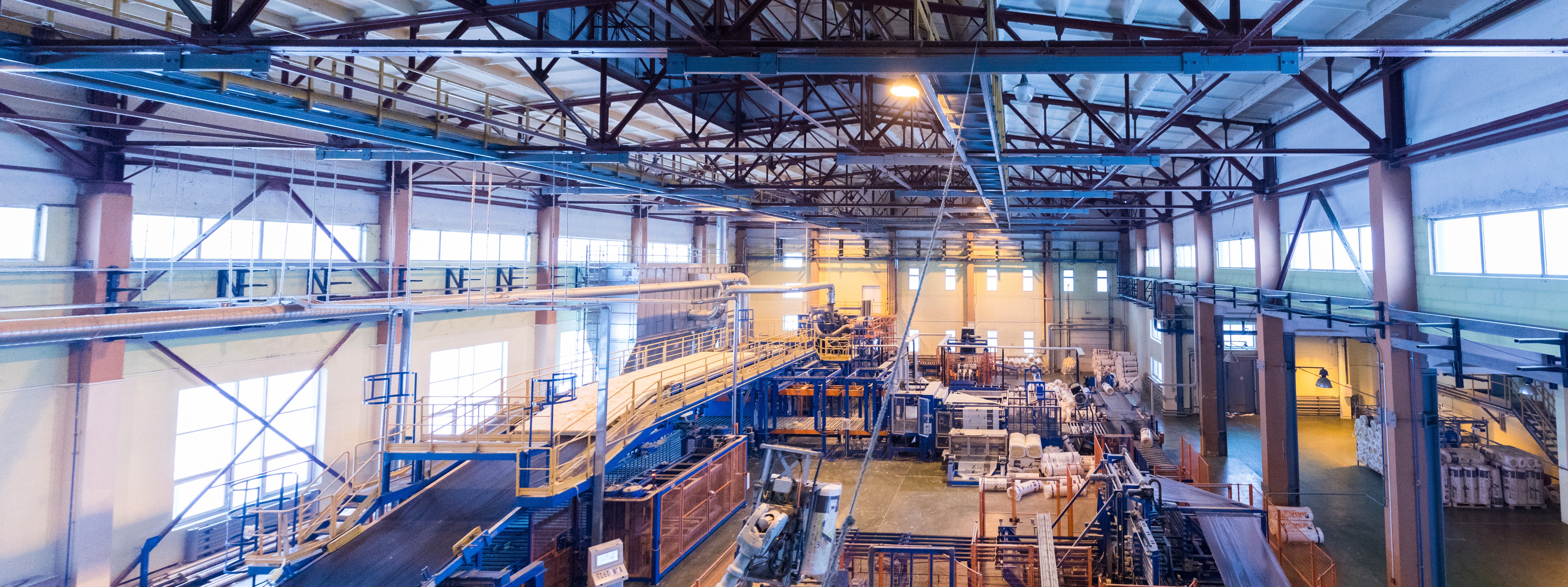 Factory workshop interior and machines on glass production background