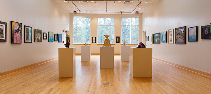 Sculptures and paintings displayed in art gallery