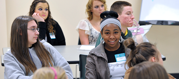 A picture of young college student in a classroom