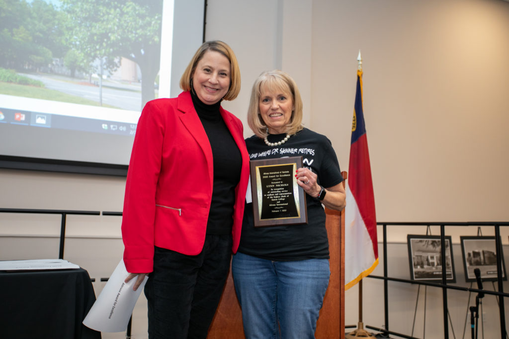 woman being presented with an award