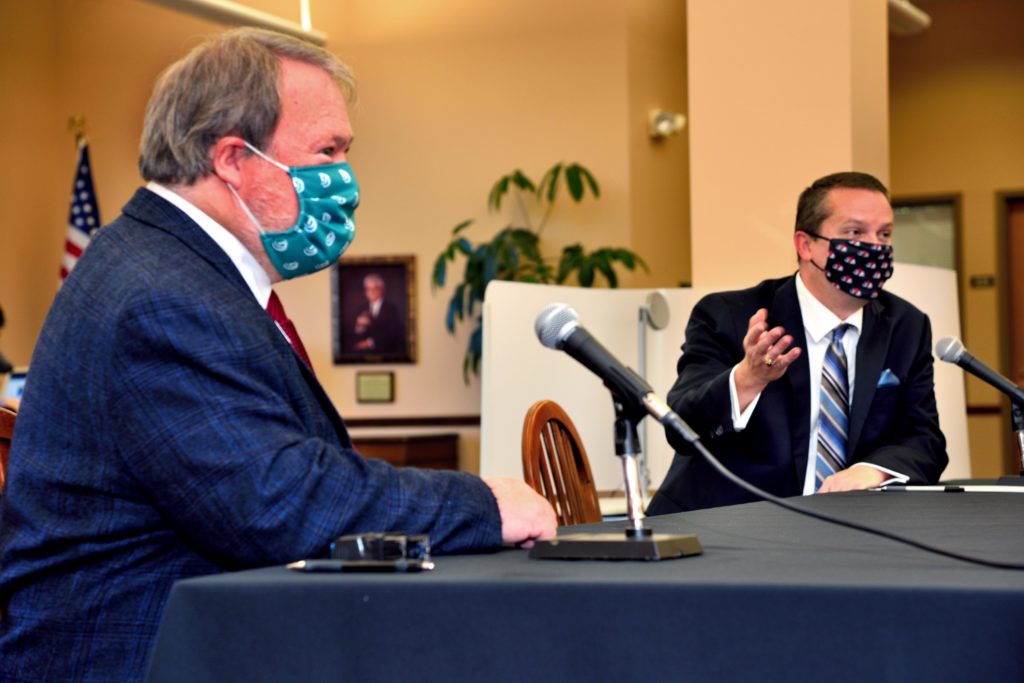 Dr. Dewey Dellinger, Vice President of Gaston College and Dr. William Downs, President of Gardner-Webb University, sign a partnership agreement.