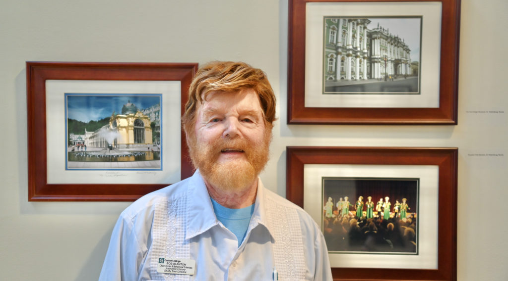 Bob Blanton standing near artwork