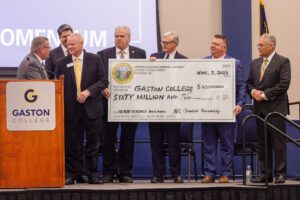 Dr. Hauser receives check from NC General Assembly